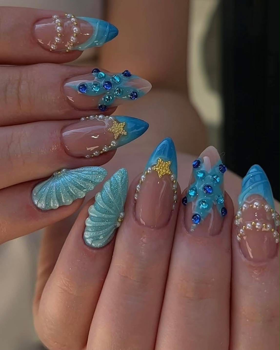 Ocean-themed nail art with pearls